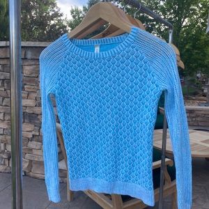 Girl’s blue sweater